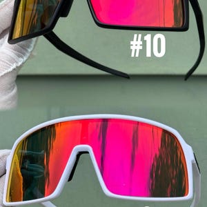 May include: Two pairs of sports sunglasses with mirrored lenses. One pair has a black frame with red and yellow lenses, the other has a white frame with red and yellow lenses. The number "#10" and "#8" are printed on the lenses.