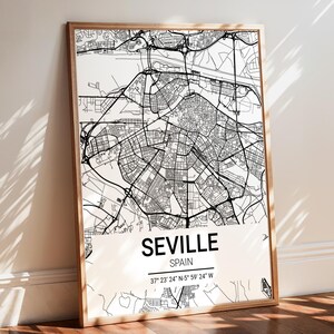 May include: Black and white map print of Seville, Spain with the city name and coordinates: 37° 23' 24" N-5° 59' 24" W.