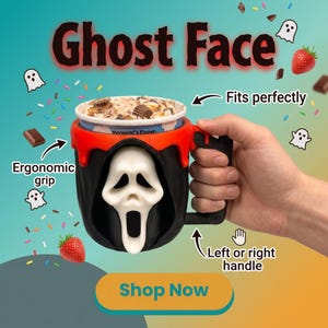 May include: A black and red ice cream pint holder featuring a white Ghost Face mask design on the front. The holder includes a handle, with text overlays reading Ghost Face, Fits perfectly, Ergonomic grip, Left or right handle, and Shop Now.