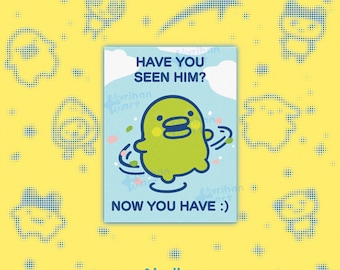 May include: A rectangular card featuring a light blue background with white clouds and a central lime green cartoon character. The text reads HAVE YOU SEEN HIM? at the top and NOW YOU HAVE :) at the bottom, with small colorful confetti accents.