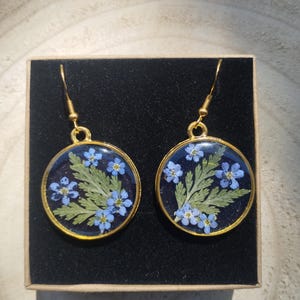 resin earrings with forget-me-not flowers