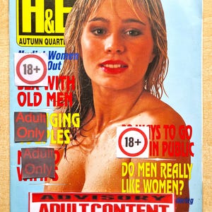 May include: A vintage International H&E magazine cover, issue number 60, featuring a portrait of a person with blonde hair. The cover includes text such as 'Autumn Quarterly', '18+', and 'Do men really like women?', partially obscured by adult content warning stickers.