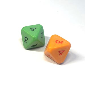 May include: Two polyhedral dice. One is green with black numbers, the other is orange with red numbers. The dice are numbered 1-4, and are used in tabletop games.
