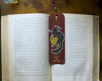 Marcador de Dreadwolf, lámina de oro y burdeos con borla de cuentas