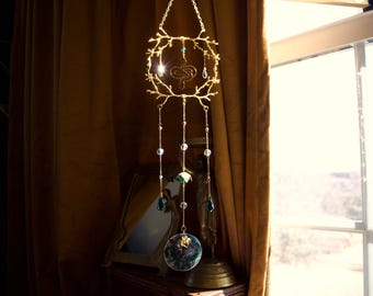 Atrapasol hecho a mano con forma de serpiente del bosque