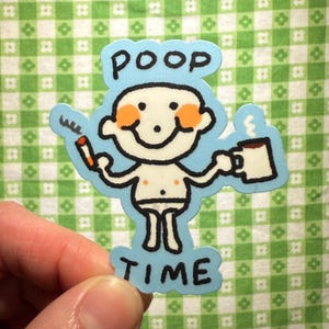 May include: A die-cut sticker featuring a cartoon character with orange cheeks, holding a lit cigarette in one hand and a steaming mug in the other. The text POOP TIME is printed in black capital letters above and below the character on a light blue background.