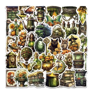 May include: A collection of whimsical stickers featuring a variety of fantasy and gothic-themed illustrations. The stickers include images of a green bus, a black cat, an owl, a witch, a hot air balloon, and a compass. The color palette is dominated by greens, oranges, and browns.