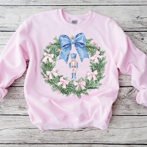 Toile de Natal PNG Coroa de Quebra-Nozes Natal PNG Preppy Quebra-Nozes Laço Coquete de Toile Azul PNG Natal Azul Design Digital Laço Rosa png