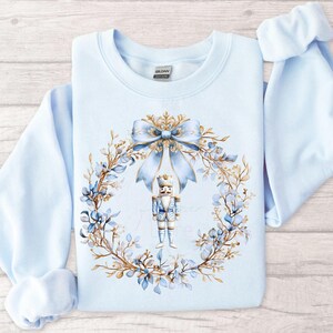 Natal PNG Chinoiserie Quebra-nozes Coquete Laço PNG Guirlanda de Natal Azul Quebra-nozes PNG Preppy Natal Toile Quebra-nozes Natal Dourado