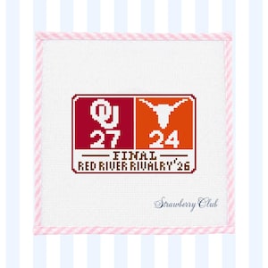 May include: A square needlepoint canvas featuring a scoreboard graphic with the Oklahoma OU logo and score 27, and a Texas Longhorn logo with score 24. Text reads FINAL RED RIVER RIVALRY '26. The border is pink and white striped.