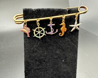 Vintage nautical theme metal bar pin with multi color charms