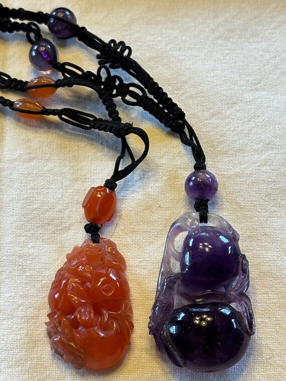 Two carved stone chinese rope necklaces