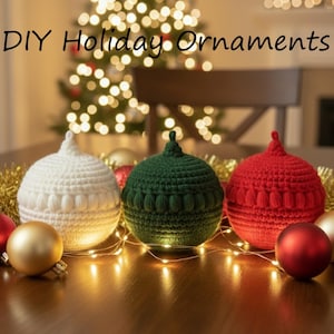 May include: Three crocheted holiday ornaments in white, green, and red, with matching red and gold ornaments. The text "DIY Holiday Ornaments" is displayed above the ornaments. A string of lights and a Christmas tree are in the background.