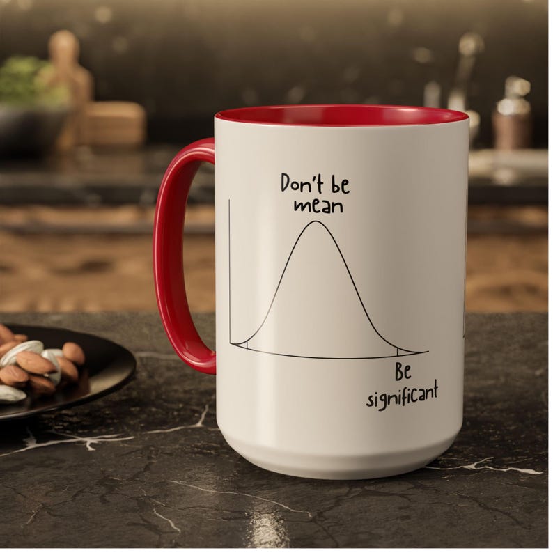 Collection of ceramic statistics mugs in multiple colors, featuring a bell curve graphic and “Don’t be mean, Be significant” design.