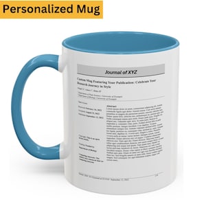 May include: A white ceramic mug with a blue interior and handle. The mug features text that reads "Journal of XYZ" and "Custom Mug Featuring Your Publication: Celebrate Your Research Journey in Style."