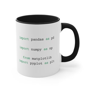 May include: White ceramic mug with a black rim and handle. The mug has green text that reads "import pandas as pd import numpy as np from matplotlib import pyplot as plt".