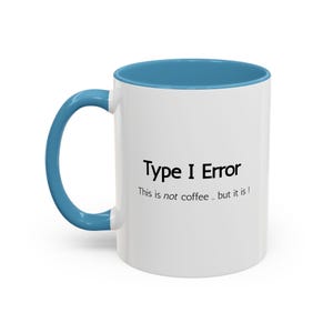 May include: White ceramic mug with a blue interior and handle. The mug features the text "Type I Error" above the phrase "This is not coffee .. but it is!" in black font. The mug is designed for hot beverages.
