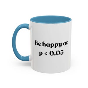 May include: White ceramic mug with a blue interior and handle. The mug features the text "Be happy at p < 0.05" in black, suitable for science lovers. A humorous gift for those who appreciate a good statistical joke.