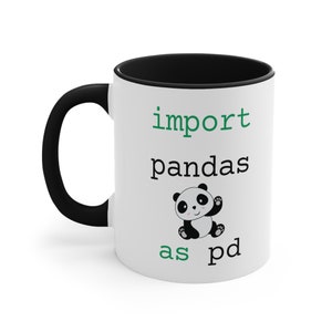 May include: White ceramic mug with a black rim and handle. The mug features a black and white panda illustration and the text "import pandas as pd" in green.