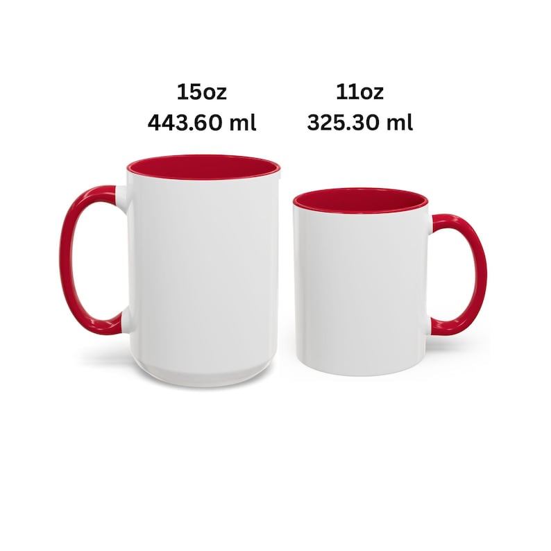 May include: Two white ceramic mugs with red interiors and red handles. The larger mug is labeled 15oz and 443.60 ml, while the smaller mug is labeled 11oz and 325.30 ml. Both mugs feature a plain white exterior surface and a cylindrical shape.