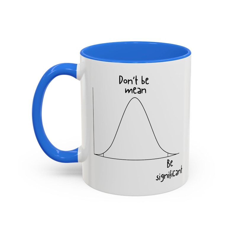 May include: A white ceramic mug with a bright blue handle and interior. The exterior features a black line drawing of a bell curve graph. The text "Don't be mean" is printed above the curve, and "Be significant" is printed below the curve.
