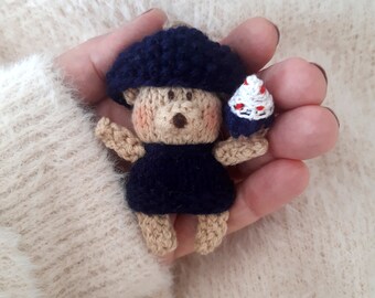 Tiny knitted Bear holding a vanilla cupcake,  9 cm. Hand knitted bear. cute. one of a kind. collectible. fall in love