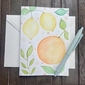 Cartão de felicitações pintado à mão com aquarela de frutas cítricas, limão e laranja