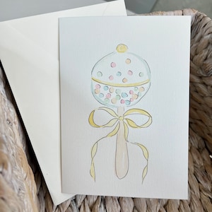 Tarjeta con sonajero para bebé - Tarjeta de acuarela pintada a mano para recién nacidos de género neutro