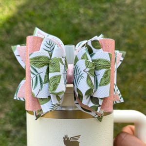 Pink and leafy white and green tumbler bow