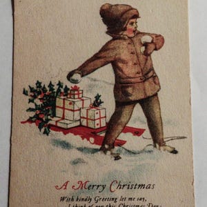 1900 年代初期のクリスマス ポストカード - 経年劣化と手書きのメッセージのあるヴィンテージ ホリデー カード