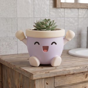 May include: A light purple planter shaped like a cheerful character with a cream-colored rim, small arms raised, and two feet at the base. The planter features a smiling face with black eyes and a pink mouth, containing a green succulent plant.