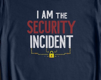 May include: A navy blue t-shirt with the text "I am the security incident" in white letters with a red outline. A yellow padlock is depicted below the text.