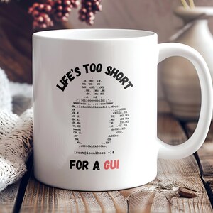 May include: White ceramic coffee mug with a black graphic that reads "Life's too short for a GUI". The graphic includes a code snippet with the text "root@localhost:~#"
