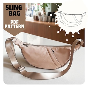 May include: A light tan sling bag with a long adjustable strap and a zipper closure. The bag has a curved shape and a small pocket on the front. The words "SLING BAG PDF PATTERN" are printed in large, bold letters.