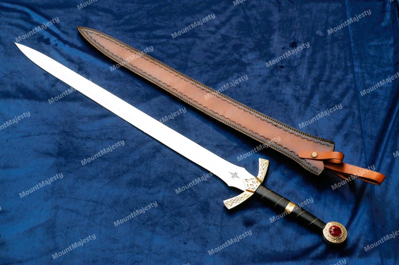 May include: A silver sword with a black handle and a gold pommel. The sword has a leather scabbard with a decorative design.