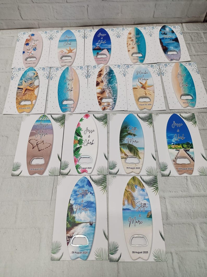 May include: A collection of surfboard-shaped bottle openers with beach-themed designs. Each opener features a unique ocean scene, including starfish, shells, and tropical landscapes. The names "Jesse & Clark" and "Stoffi & Mare" are printed on some openers, along with the date "09 August 2025".