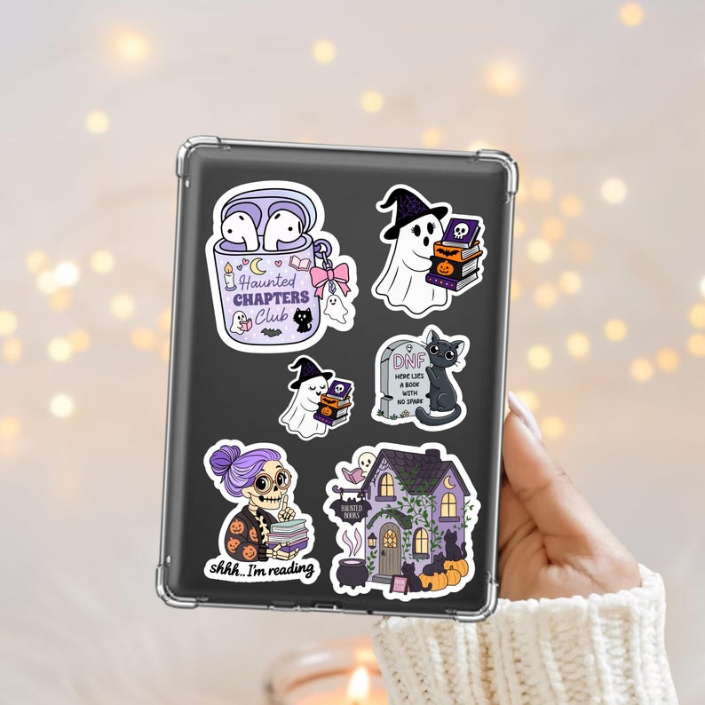 Spooky Halloween bookish themed kindle sticker png designs including ghosts, black cats, a haunted bookshop and skeleton librarian.