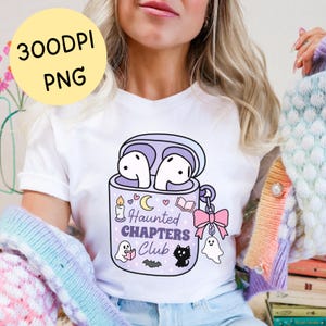 A girly spooky bookish png t-shirt mockup of a haunted themed earbuds case for readers who love audiobooks. The case has the text "Haunted Chapers Club". The case is decorated with a pink bow, ghosts, sparkles, a bat, black cat, candle, book and the moon.