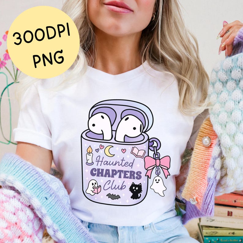 A girly spooky bookish png t-shirt mockup of a haunted themed earbuds case for readers who love audiobooks. The case has the text "Haunted Chapers Club". The case is decorated with a pink bow, ghosts, sparkles, a bat, black cat, candle, book and the moon.