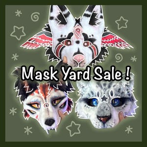 May include: Three animal-themed masks with the text Mask Yard Sale! The top mask is white with black markings and red accents. The bottom left mask features red, black, and white fur with yellow eyes. The bottom right mask is white with grey spots.