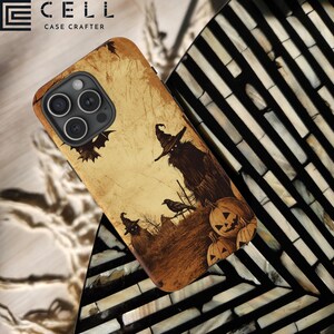 May include: A phone case with a Halloween theme. The case features a vintage-style design with a spooky scene including a witch, pumpkins, and bats. The case has the text "CELL CASE CRAFTER" at the top.