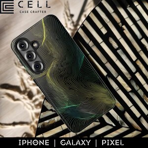 May include: Black smartphone case with a topographic design in yellow and green. The case is for an iPhone, Galaxy, or Pixel phone. The brand name "E CELL CASE CRAFTER" is at the top.