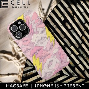 May include: Pink iPhone case featuring a design of pink lips, clouds, and yellow lightning bolts. The case is for an iPhone 13 or later and is MagSafe compatible. The brand name "CELL CASE CRAFTER" is printed on the top left of the case.
