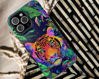 May include: A phone case featuring a vibrant tiger design with a colorful, rainbow-like gradient. The case has a dark blue background with green and purple foliage. The brand name "CELL CASE CRAFTER" is printed at the top.