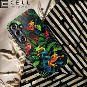 May include: A phone case with a colourful design of frogs amongst green leaves and blue accents. The case has a black border and the text "E CELL CASE CRAFTER" at the top.