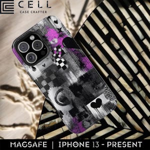 May include: A phone case with a black, white, and purple abstract design. The case features a checkerboard pattern, hearts, and other graphic elements. The text "MAGSAFE | IPHONE 13 - PRESENT" is at the bottom. The case is for an iPhone.