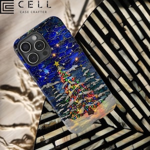 May include: A black phone case with a stained glass design of a Christmas tree with colorful lights. The case has a blue background with white snow and a gold star on top of the tree. The case has the text "CELL CASE CRAFTERS" on the top.