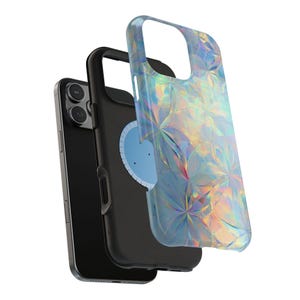 May include: A black smartphone with a protective case and a separate iridescent cover. The cover has a geometric pattern that reflects multiple colors. The phone case is black and has a light blue circular design on the back.
