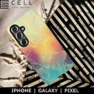 May include: A smartphone case with a colorful, abstract design featuring shades of yellow, orange, purple, and blue. The case has a camera cutout and the text "E CELL CASE CRAFTER" at the top. The bottom of the case has the text "IPHONE | GALAXY | PIXEL".