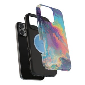 May include: A black smartphone with a protective case featuring a colorful, abstract design in shades of blue, purple, yellow, and pink. The case is composed of multiple layers, showcasing the phone's camera and buttons.